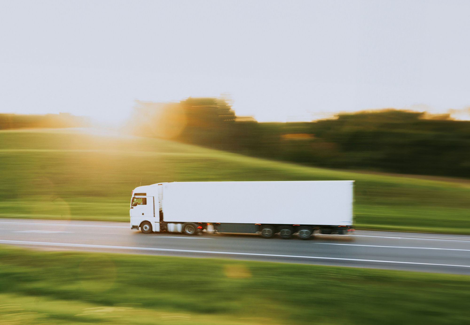 White freight truck on a highway